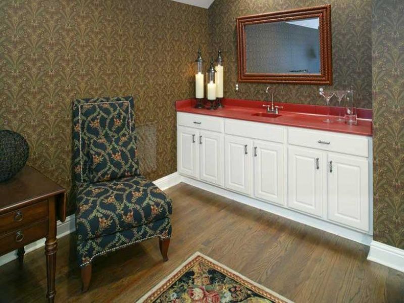 white cabinet with red counter and sink
